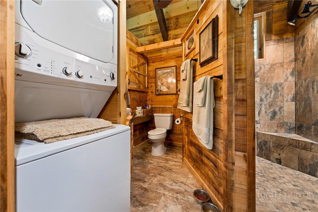 165 Natures Way Boone, NC 28607 - Photo 27 of 50 a bathroom with a granite countertop toilet and a shower