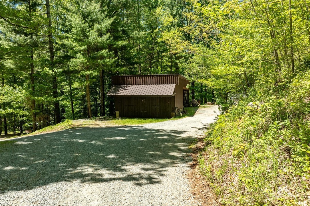 165 Natures Way Boone, NC 28607 - Photo 38 of 50 a house with trees in front of it