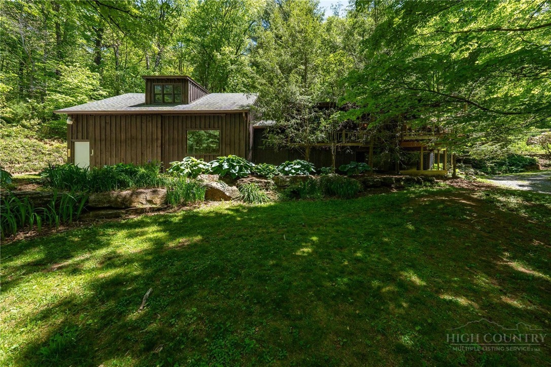165 Natures Way Boone, NC 28607 - Photo 43 of 50 a front view of a house with garden