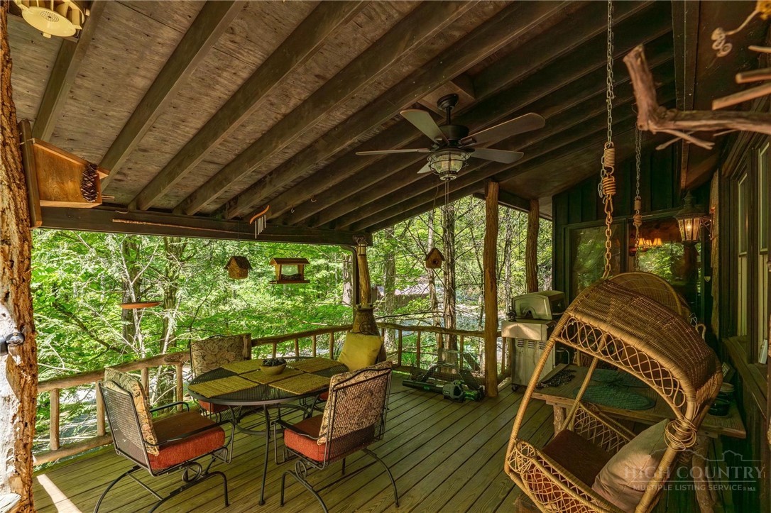 165 Natures Way Boone, NC 28607 - Photo 6 of 50 a view of a chairs and table in patio with wooden floor