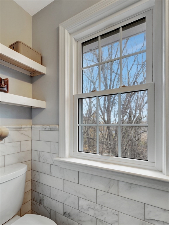 57 Clough Road, Unit 57 Dedham, MA 02026 - Photo 15 of 24 a bathroom with a toilet a sink and a window