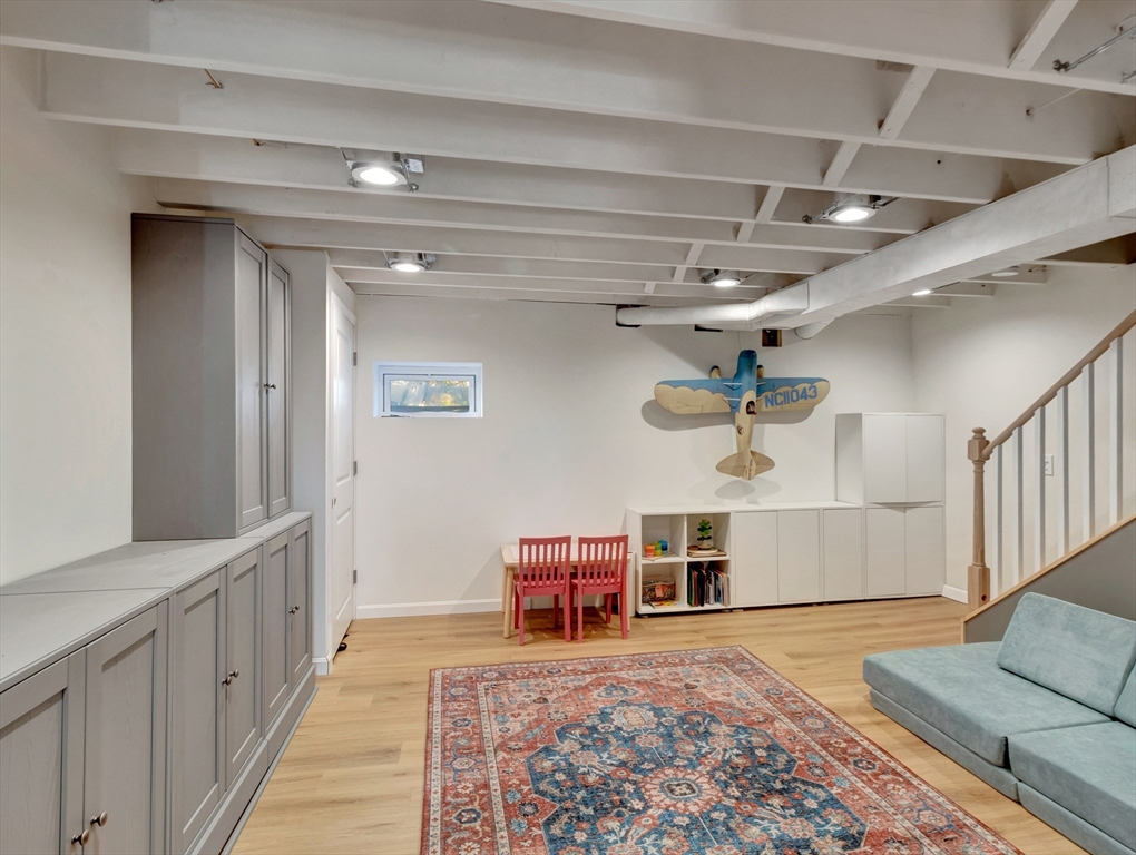 57 Clough Road, Unit 57 Dedham, MA 02026 - Photo 22 of 24 a view of a livingroom with furniture and a ceiling fan