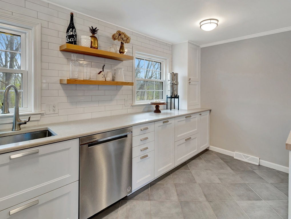 57 Clough Road, Unit 57 Dedham, MA 02026 - Photo 6 of 24 a view of a sink and cabinets