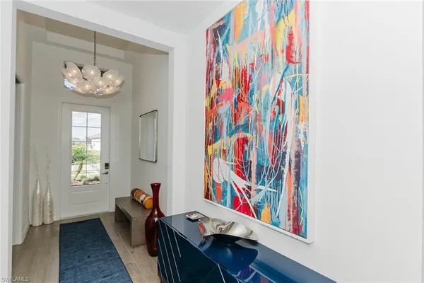 a room with furniture and painting on the wall