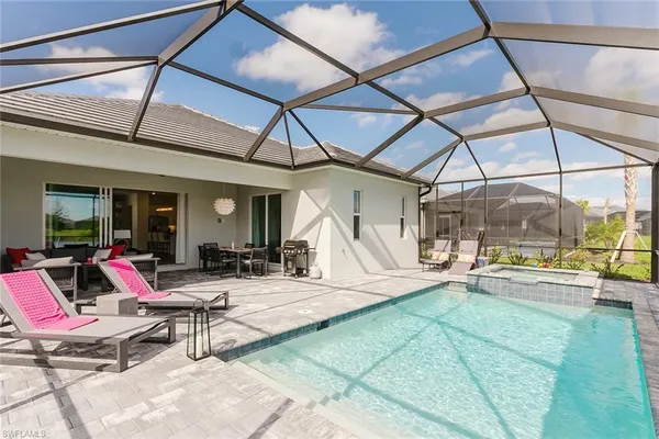 a view of a dinning table and chairs in the patio