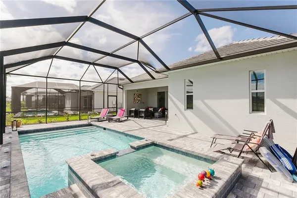 a view of a swimming pool with a patio