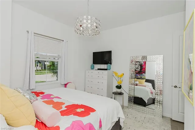 a bedroom that has a bed and a tv in it