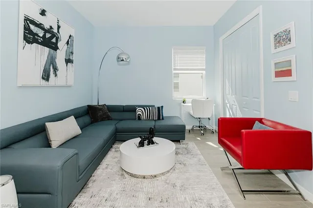 a living room with furniture and a couch