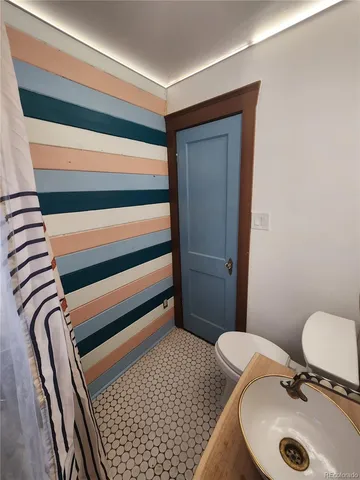 a view of a storage and utility room with washer and dryer