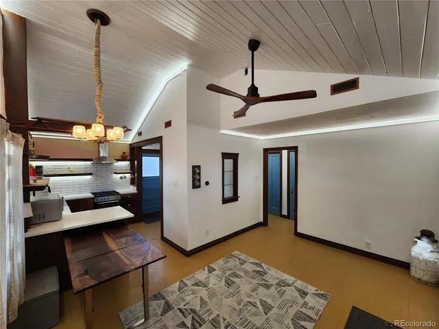 a view of a livingroom with furniture and staircase