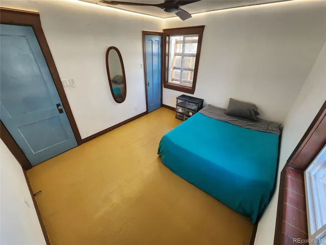 a room with window and a ceiling fan