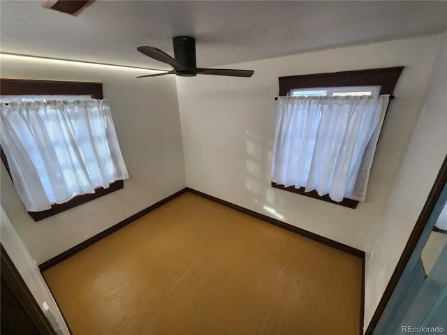 a view of a hallway with wooden door