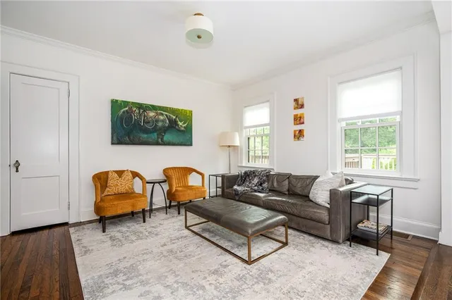 a bedroom with a bed and chandelier