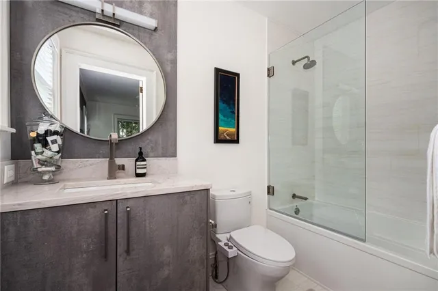 a bathroom with a toilet a sink and a shower