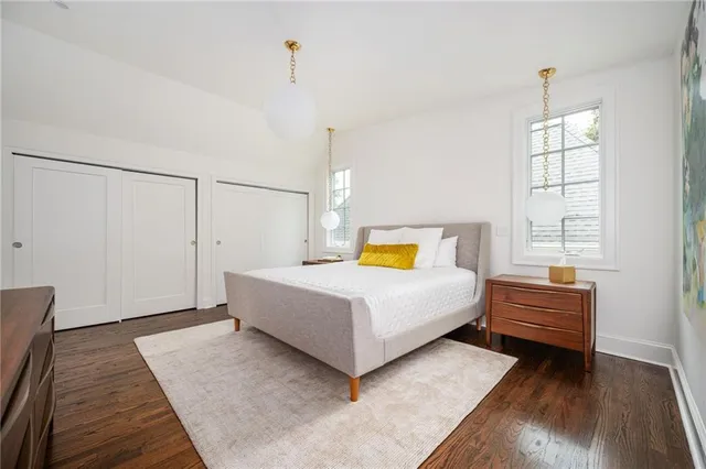 a view of a room with wooden floor and windows