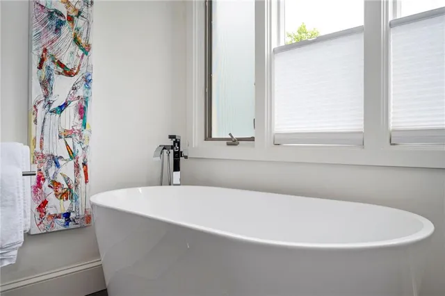 a view of a deck with barbeque grill and wooden floor