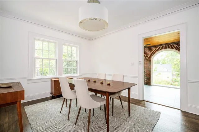 a kitchen with stainless steel appliances granite countertop a refrigerator a sink a stove a microwave and wooden floors