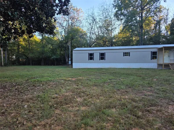 a view of a backyard of the house