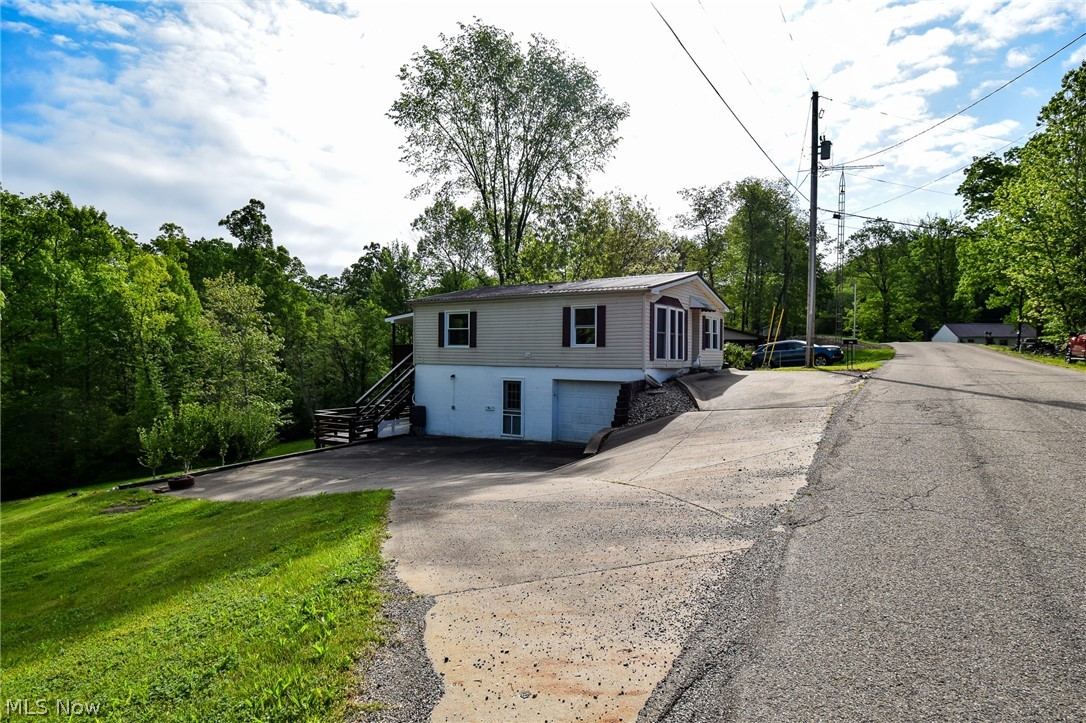 26933 Marina Road Freeport, OH 43973 - Photo 2 of 18 View of front of property with a garage
