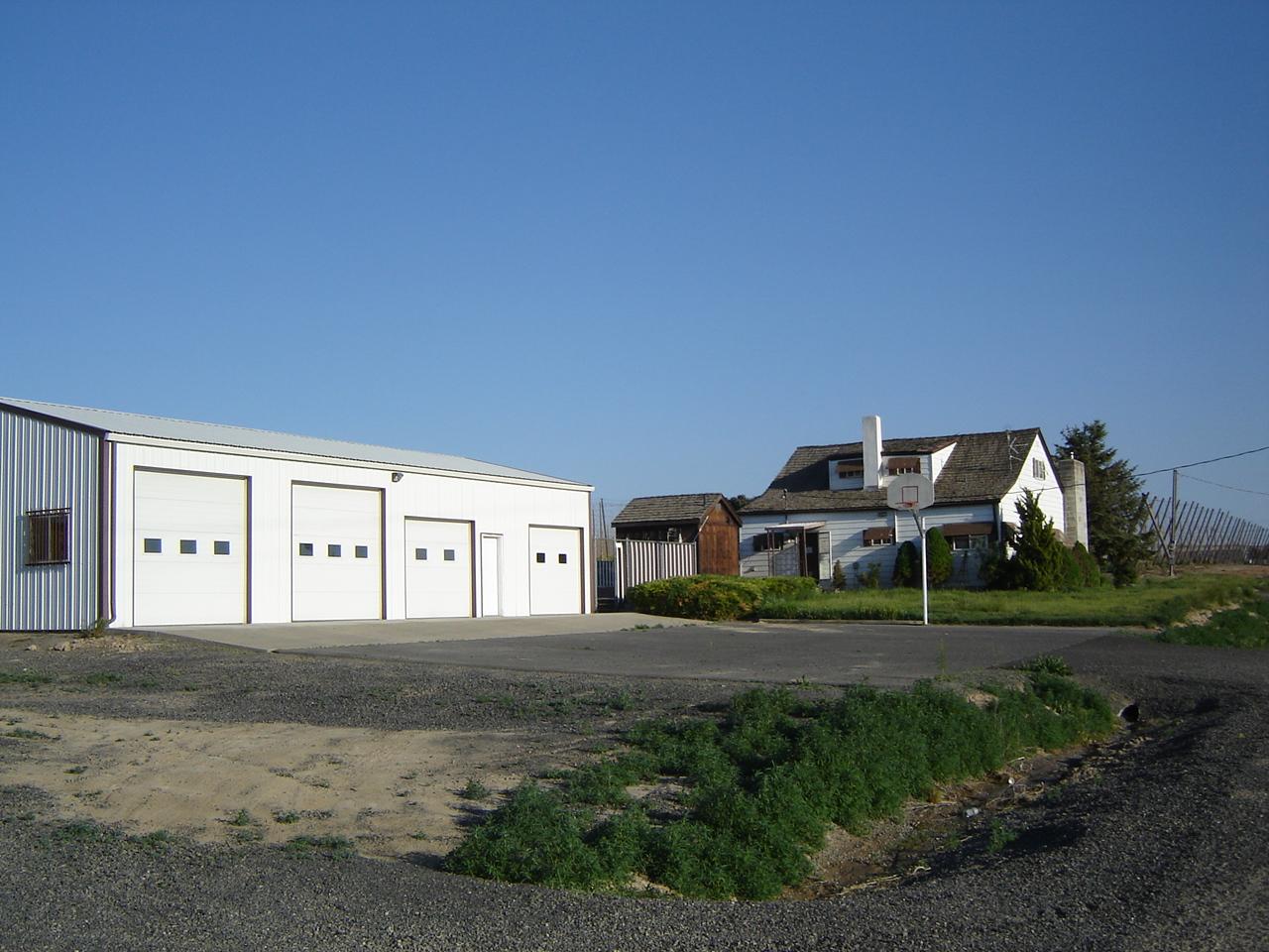 2411 Duffield Road Moxee, WA 98936 - Photo 2 of 13 a front view of a house with a yard