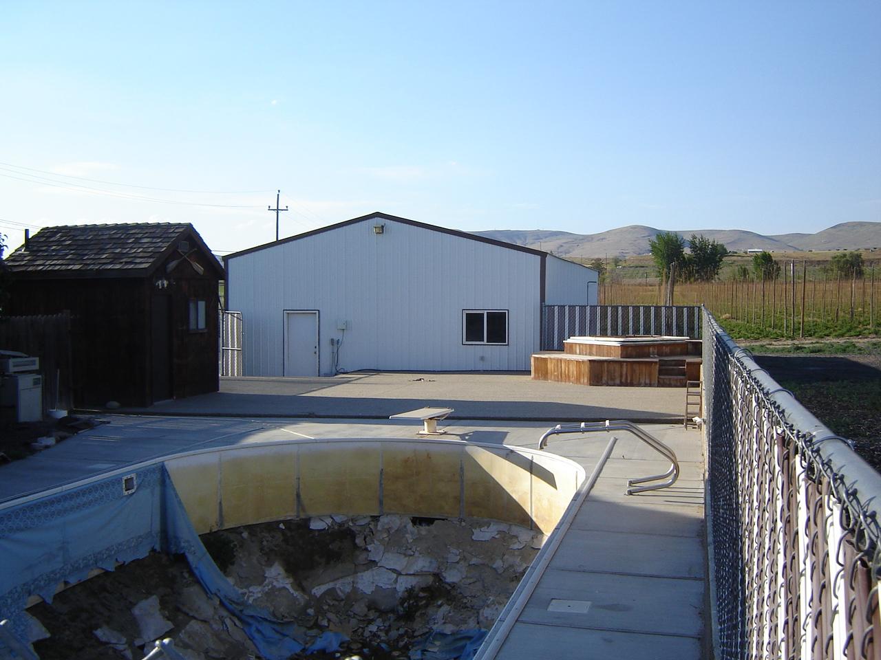 2411 Duffield Road Moxee, WA 98936 - Photo 13 of 13 a view of a swimming pool with seating space
