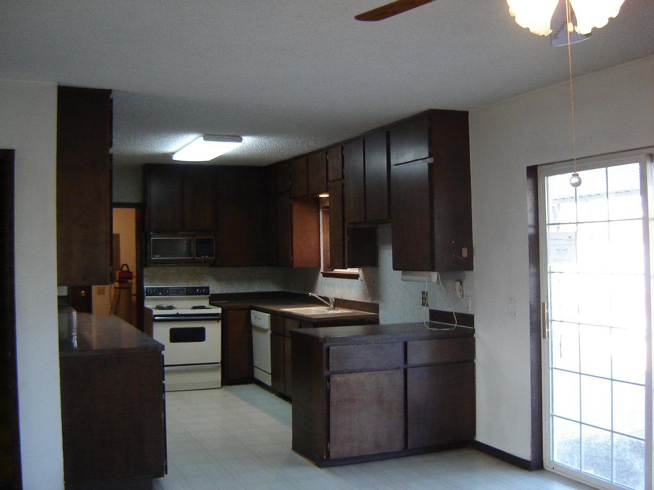 2411 Duffield Road Moxee, WA 98936 - Photo 5 of 13 a kitchen with stainless steel appliances granite countertop a stove a sink and a refrigerator