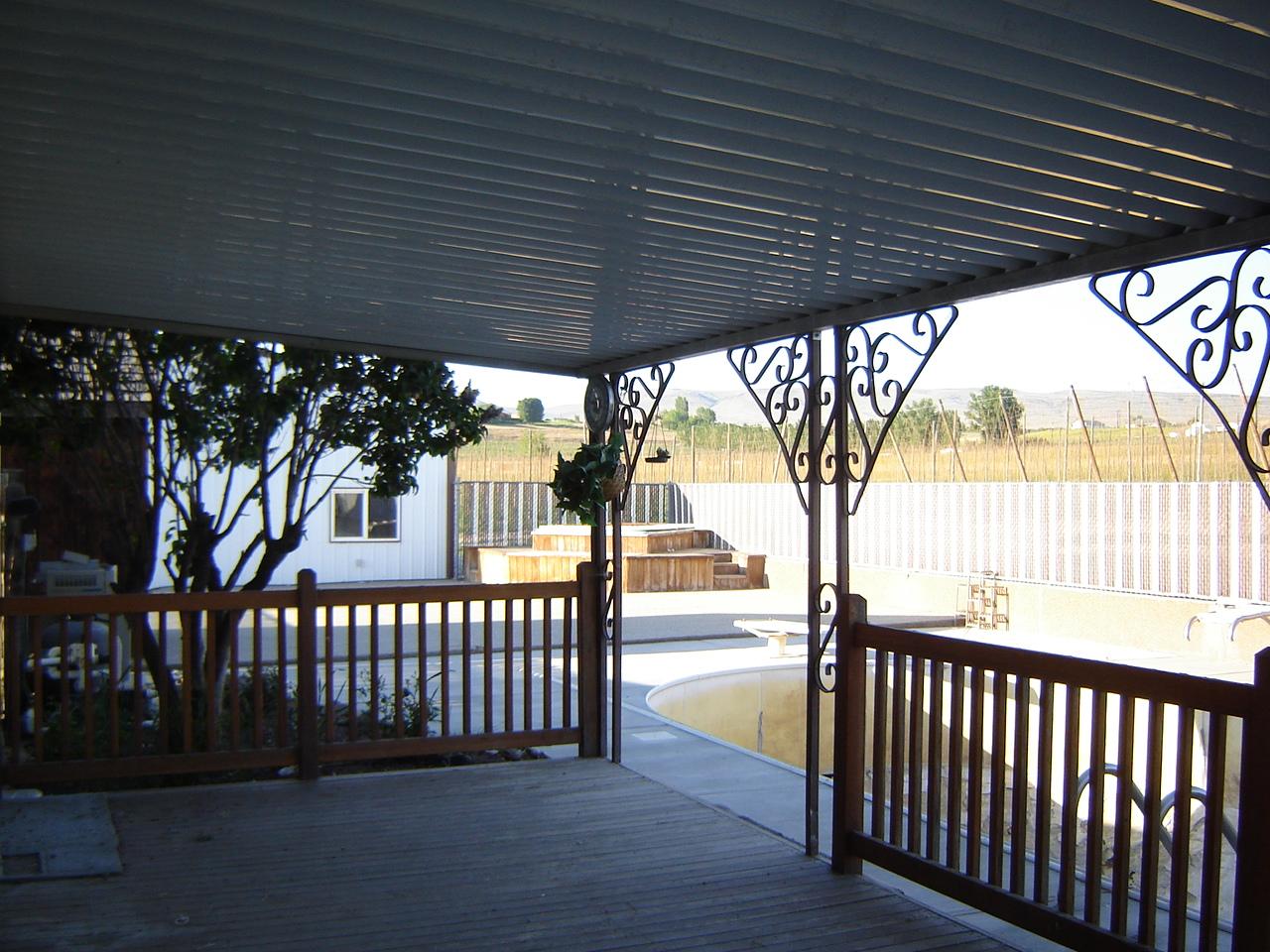 2411 Duffield Road Moxee, WA 98936 - Photo 7 of 13 a view of a porch with wooden floor and outdoor space
