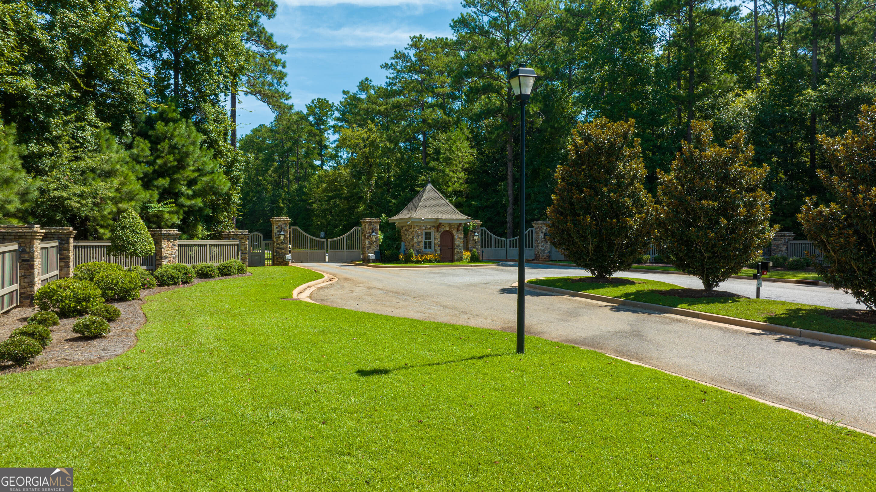 153 Camden Trace Macon, GA 31210 - Photo 6 of 8 a swimming pool with a yard and large trees