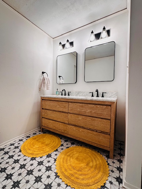 810 Kc 271 Junction Junction, TX 76849 - Photo 12 of 20 Full bathroom with double vanity and ornamental molding