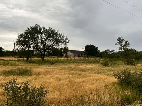 a view of a lake with a big yard