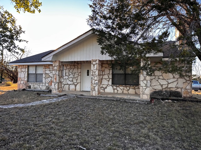 810 Kc 271 Junction Junction, TX 76849 - Photo 3 of 20 View of front facade with stone siding and covered porch