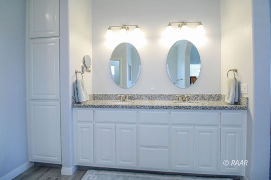 428 Scott Street Ridgecrest, CA 93555 - Photo 16 of 35 a bathroom with double vanity sinks and a mirror
