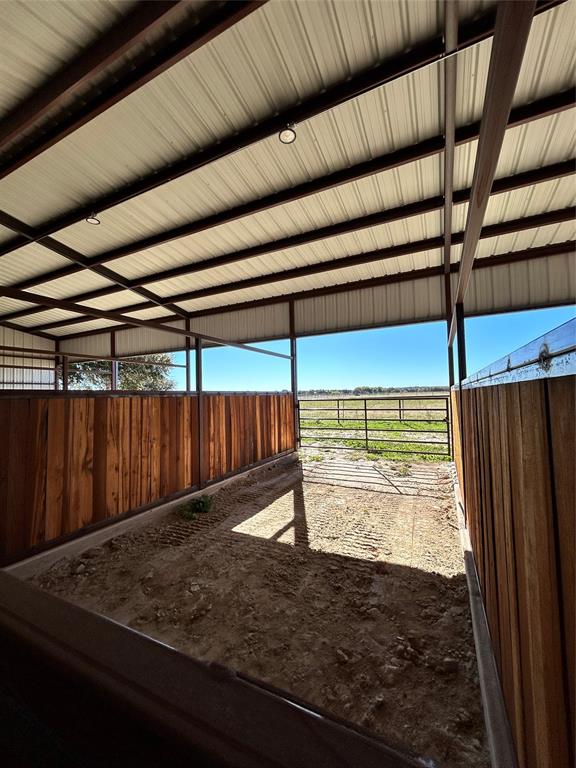 8740 Star Hollow Road Lipan, TX 76462 - Photo 11 of 40 a view of a room with wooden walls