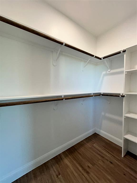 8740 Star Hollow Road Lipan, TX 76462 - Photo 17 of 40 an empty room with wooden floor