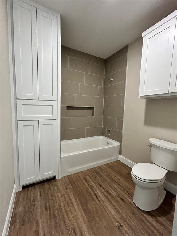 8740 Star Hollow Road Lipan, TX 76462 - Photo 20 of 40 a bathroom with a toilet and a bathtub