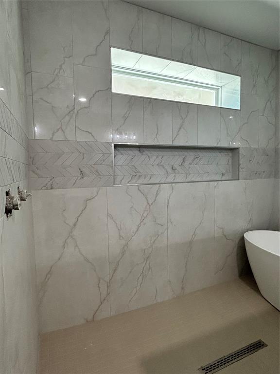 8740 Star Hollow Road Lipan, TX 76462 - Photo 22 of 40 a bathroom with a bathtub