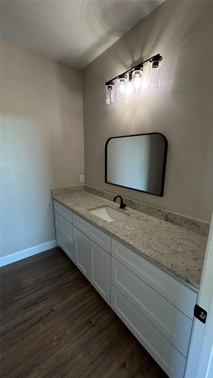 8740 Star Hollow Road Lipan, TX 76462 - Photo 4 of 40 a bathroom with a granite countertop sink and a mirror