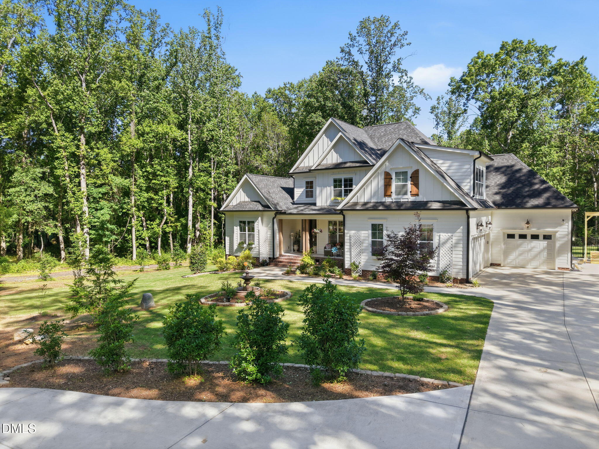 3511 Bruce Garner Road Wake Forest, NC 27587 - Photo 54 of 56 a front view of a house with garden