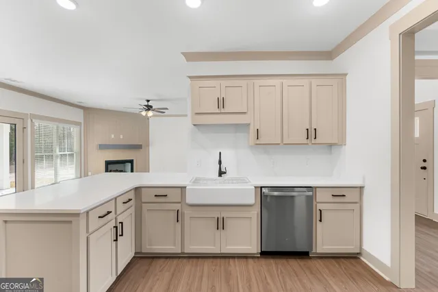 a kitchen with white cabinets and white appliances