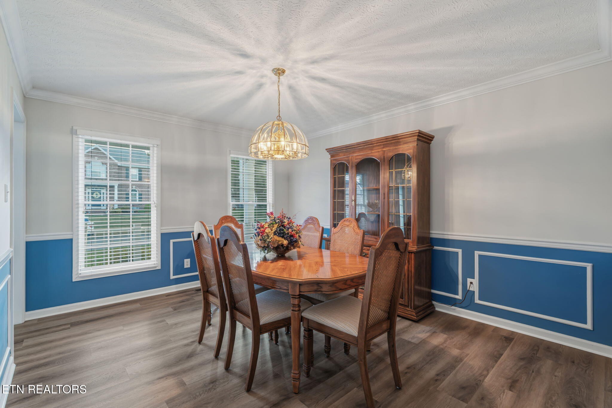 7030 Westerly Winds Road Knoxville, TN 37931 - Photo 20 of 40 a view of a dining room with furniture window and wooden floor