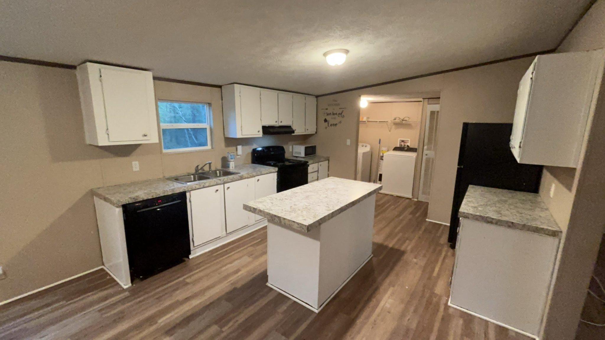 8510 Darcy Lane Partlow, VA 22534 - Photo 19 of 27 a kitchen with a sink stove and refrigerator