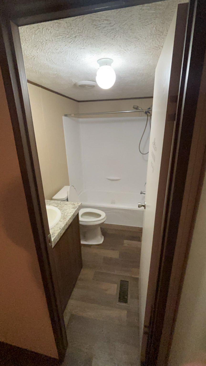 8510 Darcy Lane Partlow, VA 22534 - Photo 22 of 27 a bathroom with a sink and mirror