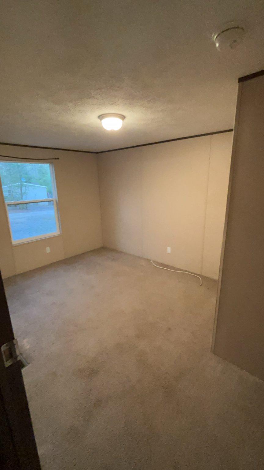 8510 Darcy Lane Partlow, VA 22534 - Photo 25 of 27 an empty room with a empty space and windows