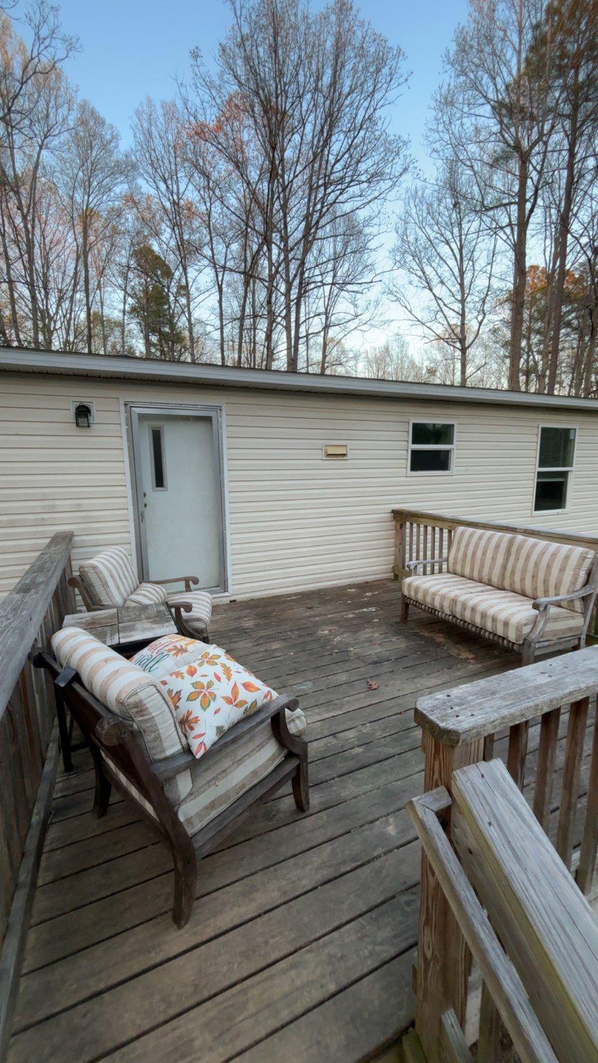 8510 Darcy Lane Partlow, VA 22534 - Photo 26 of 27 a roof deck with table and chairs