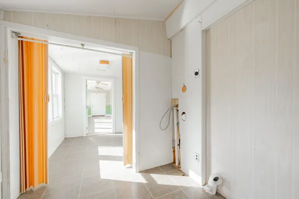 a view of an empty room with a window