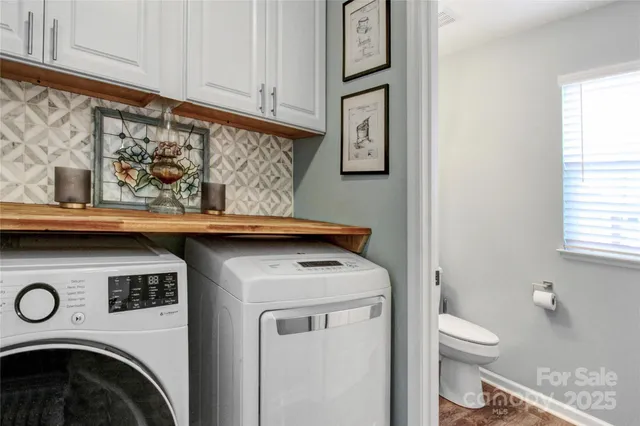a utility room with dryer and washer
