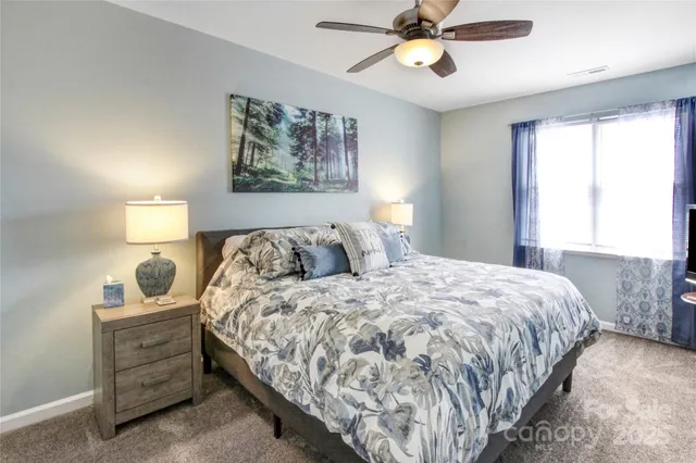 a bedroom with bed and window