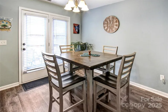 a view of a dining room with furniture and a window