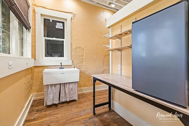 a bathroom with a sink a mirror and a shower