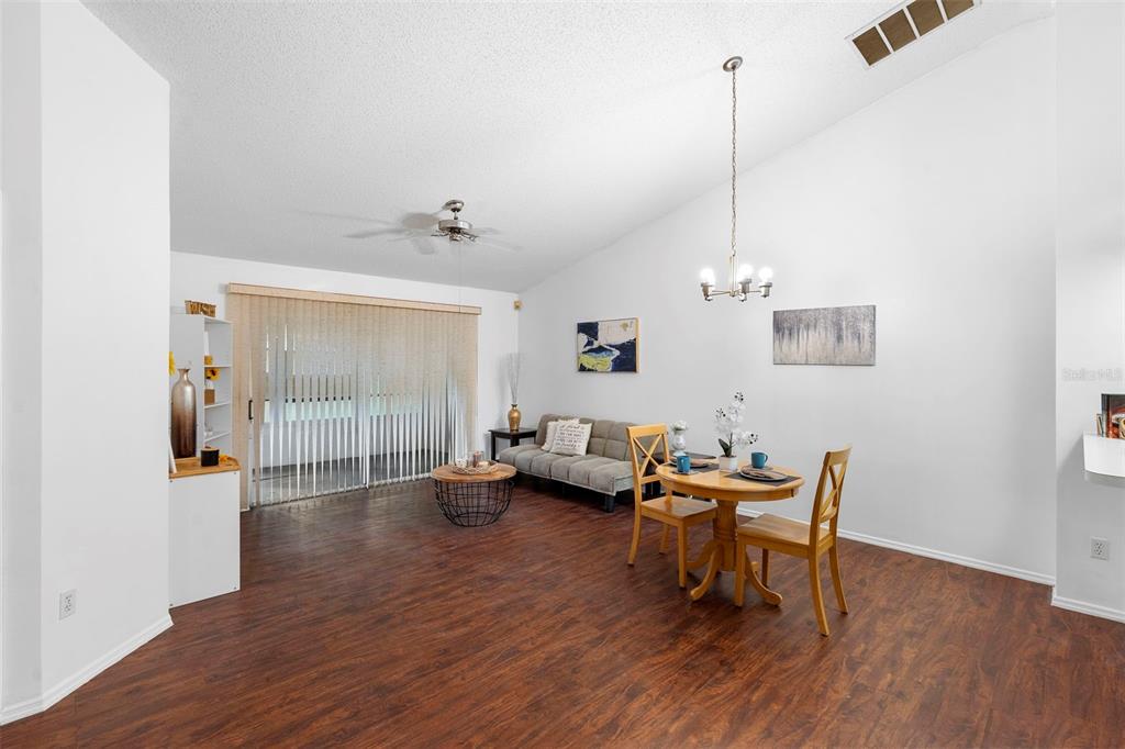 13103 Edberg Court Orlando, FL 32824 - Photo 13 of 42 a view of a livingroom with furniture and wooden floor